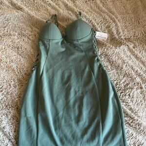 Sea foam Dress with cups . Criss cross on side . Never worn size 2